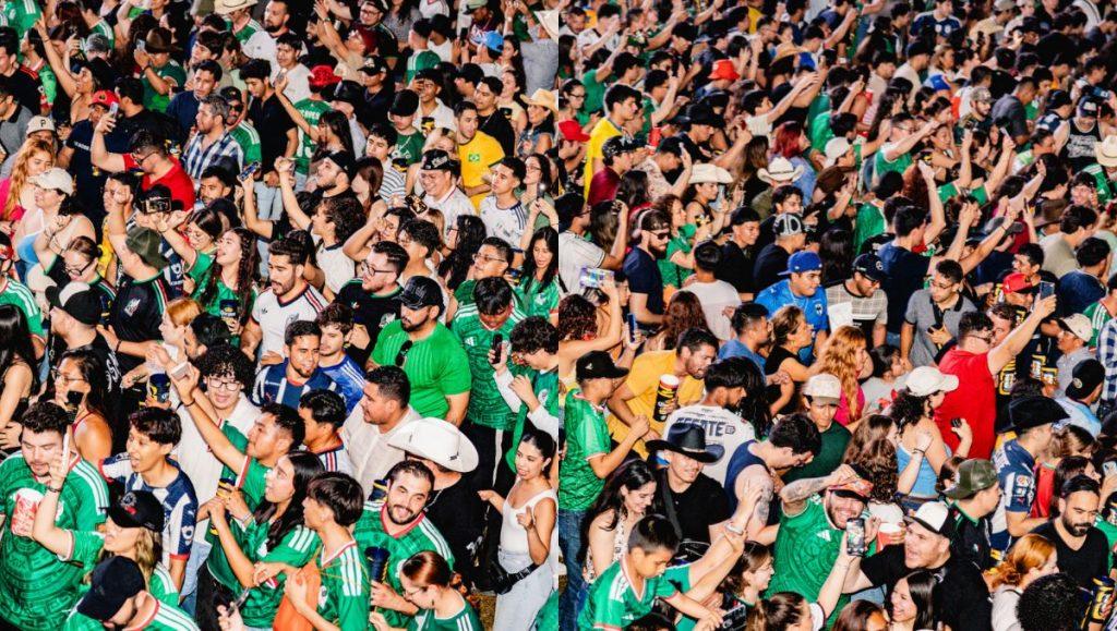 Banda-convirtio-presentacion-autentica-fiesta • Guadalupe Informa Dense Crowd of Festival or Stadium Attendees, Many in Green Shirts, Raising Hands and Taking Photos with Phones from Above • Guadalupe Informa