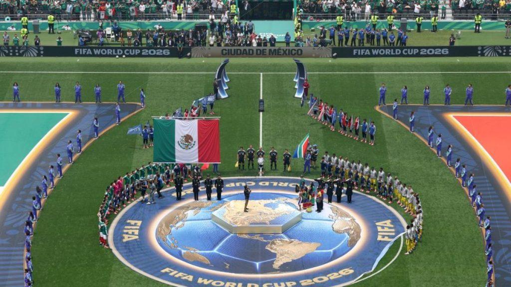 Wide View of a Fifa World Cup 2026 Opening Ceremony on a Football Pitch, with Teams Lined Up Around a Circular Globe Emblem on the Ground and the Mexican Flag Displayed Centrally. • Guadalupe Informa