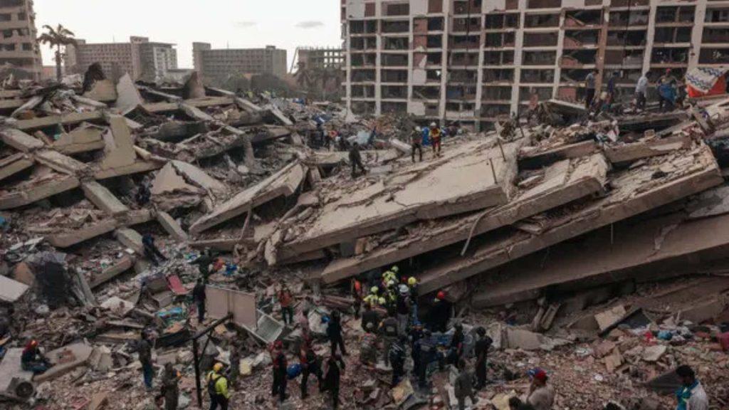 Rescue Workers Search Through Rubble of a Collapsed Multi-story Building in an Urban Disaster Scene. • Guadalupe Informa