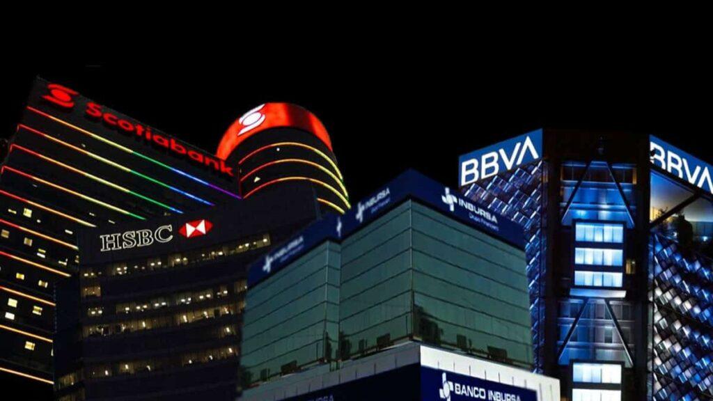 Bancos-mejor-evaluados-de-mexico • Guadalupe Informa Night Cityscape of Bank Buildings with Illuminated Logos: Scotiabank, Hsbc, Bbva on a Modern Financial District Backdrop. • Guadalupe Informa