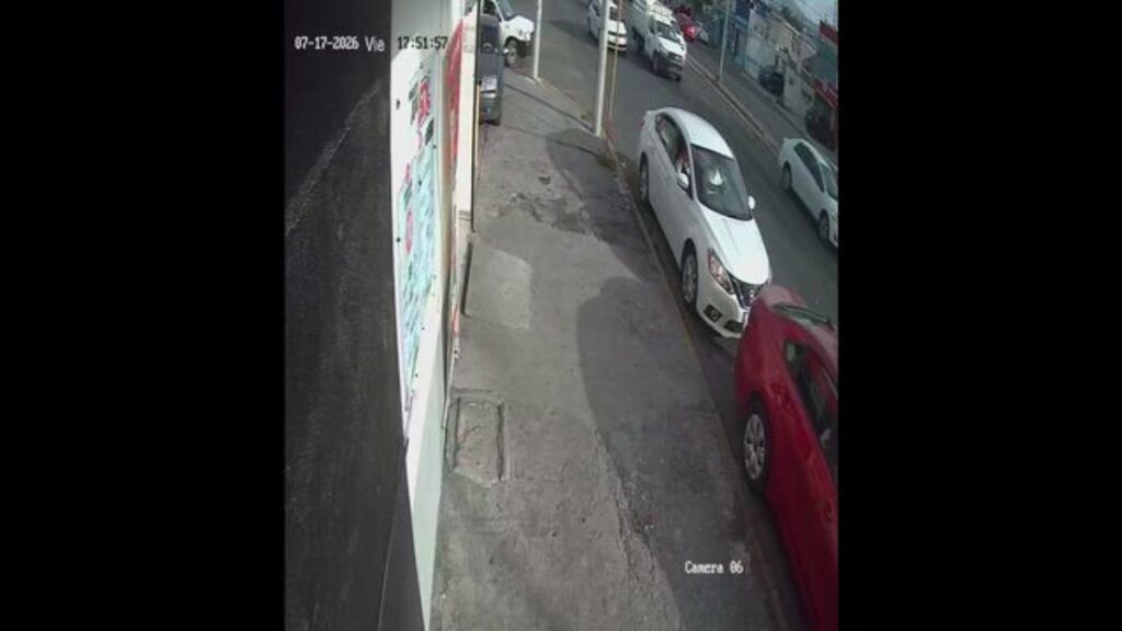 Surveillance Still of a Narrow Sidewalk Beside Parked Cars Along a City Street; Timestamp Top-left Reads 07-17-2025 17:51:57. • Guadalupe Informa